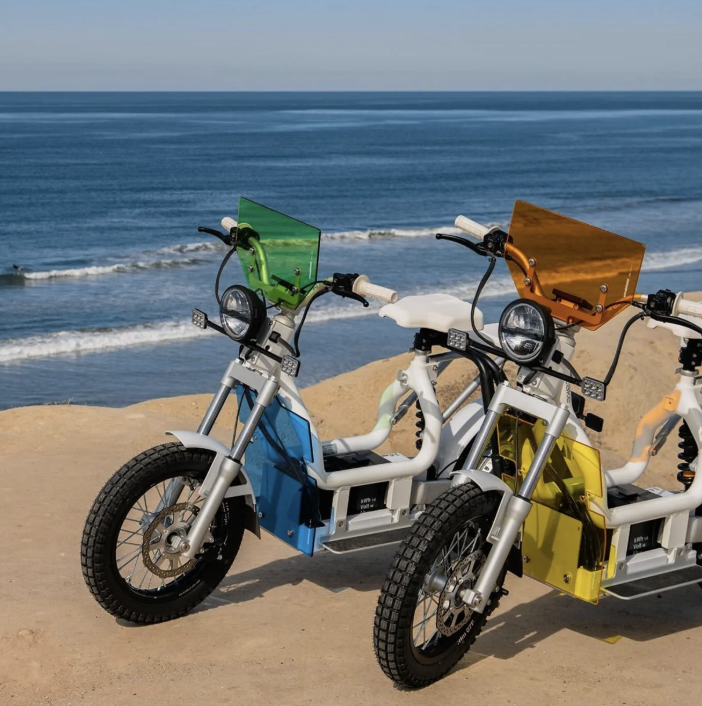 Colourful CAKE motorcycles overlooking the sea