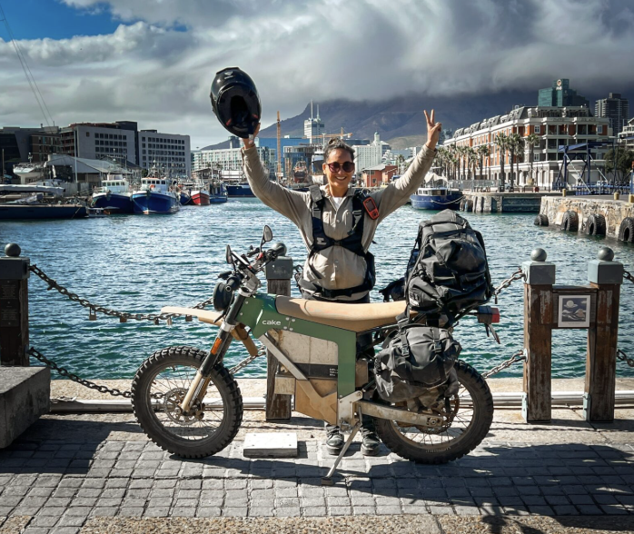 Adventure rider with a loaded CAKE motorcycle