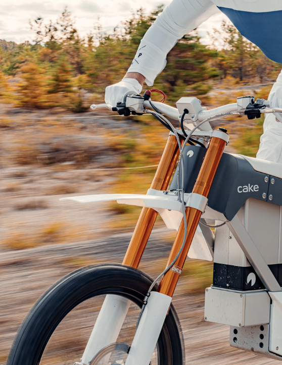 CAKE motorcycle in motion on a trail